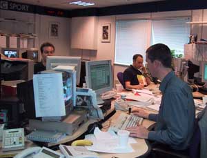 Journalists at work in the BBC News Online production centre in London