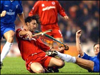 Fiddling footballer.