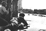 Two French soldiers in the shadow of the Arc de Triomphe, 1944