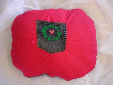 Denim cushion with pocket front.