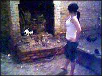 Woman surveys flood damage