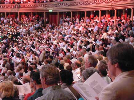 Audience members with their hymn sheets