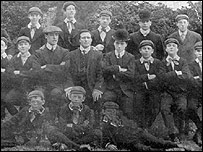 The early Charlie Chaplin (centre in bowler)
