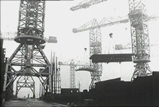 cranes high above the shipyard