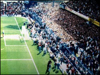 Fans spill on to the pitch