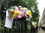 flowers attached to railings in memory of 14 year old shaquille smith from hackney who was stabbed to death