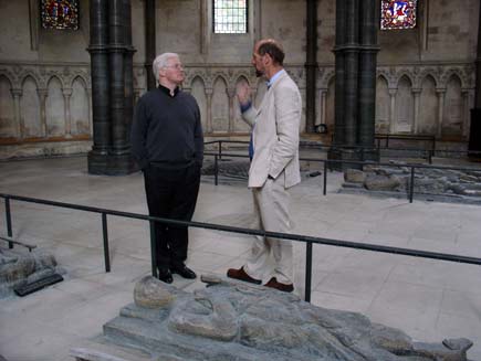 Robin Griffiths-Jones (left) with Martin Palmer, with effigies of knights Templar visible among the stone pillars of the church interior