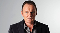 Ash (Robert Glenister) attempts to con an unscrupulous football agent