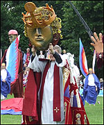 The Dean holds up the head of St Alban