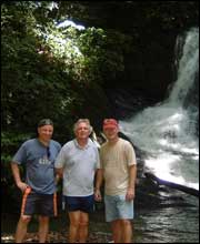 Intrepid trio on their final trip to the Brunei rainforest, near a waterfall