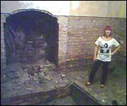 Woman surveys flood damage