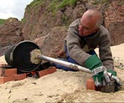 Mike Bullivant carrying out an experiment to show how oil can be extracted from peat