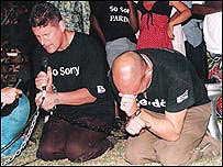 Andrew Hawkins knelt and apologised