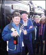 Alan Titchmarsh pops the champagne cork at the rededication ceremony