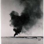 Hudson crashes into petrol dump in the act of taking off on a detachment prior to El Alemein. Photographs of the crash and the burial of the victims. Another shot of crashed Hudson