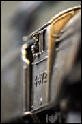 Close up of the driver on the bronze model of the Flying Scotsman