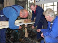 Dave, Charlie and Tim working on an old boat