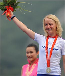 Britain's Emma Pooley, from Norfolk, celebrates on the podium with her silver medal