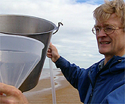 Nicholas Crane helping with an experiment to show the effect of the weather on sea levels