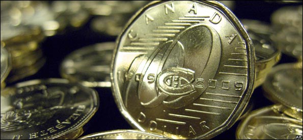 Commemorative one-dollar coins marking the 100th anniversary of the Montreal Canadiens NHL hockey team are seen Tuesday, March 10, 2009, in Montreal after they were unveiled by the Royal Canadian Mint