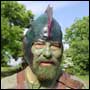 Bearded man in helmet and green makeup