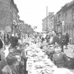 Edward Street, Dunstable, VE Day Tea Party - May 1945. Author, Mr A W Morgan is pictured on the right, just above the head of the Reverand (back to camera). Edward Street, Dunstable, VE Day Tea Party - May 1945. Author, Mr A W Morgan is pictured on the right, just above the head of the Reverand (back to camera).