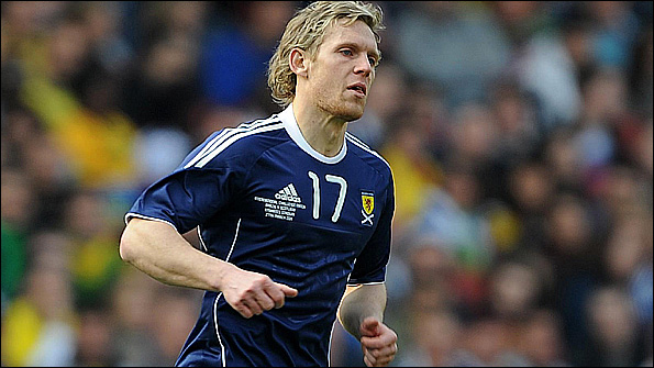 Craig Mackail-Smith in action for Scotland.