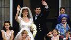 The Duke and Duchess of York stand waving on the balcony of Buckingham Palace on their wedding day, 23 July 1986.