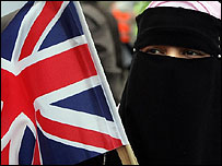 Muslim waving British flag - Matt Writtle/PA