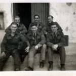 Some of the lads outside a hangar, which had been converted into a billet (50 people slept in it)