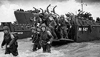 American soldiers disembark from their landing craft at the shores of Normandy