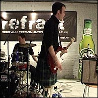Guitarist, Charlie Milne in his kilt at An Evening of Scottish-ness