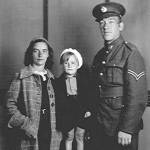 Torquay, Devon. 16th September 1939: Corporal Harry Brooks, 36 (Royal Artillery, Searchlights) with wife ‘Doll’, 35, and son Brian, 4. Mrs Brooks’s feelings at starting a war three months pregnant are very clear - her expression says it all.