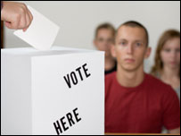 Paper being put into a ballot box