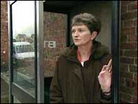 Shirley Stocks in a phone box