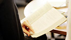 Person leafing through a book