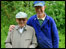 two men standing infront of trees