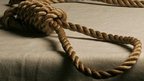 Noose draped on a table