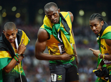 Usain Bolt celebrates with Jamaica's Yohan Blake and Warren Weir after the men's 200m final.