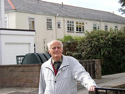 Michael Ginns OBE outside what is left today of the Palace Hotel in St Helier, Jersey.