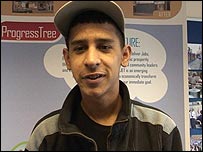 Young muslim man with Baseball cap, smiling.