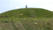 One of the five Garth Hill burial mounds in the distance.