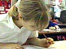 Child writing at school