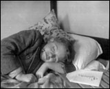 One child recovering from a long journey at Dovercourt holiday camp.