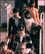 Ugandan Asians leaving the plane in England