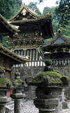 Pagoda-style roofs and stone lanterns of Tosho Gu shrine in Nikko, Japan