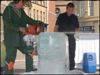 Dave Gross sculpting ice with a chainsaw