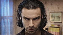 Mitchell (Aidan Turner) is implicated in the Box Tunnel 20 massacre