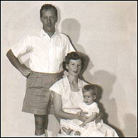 Mervyn Morgan with his wife and child
