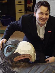 Cllr Steve Coen with the Salford totem pole